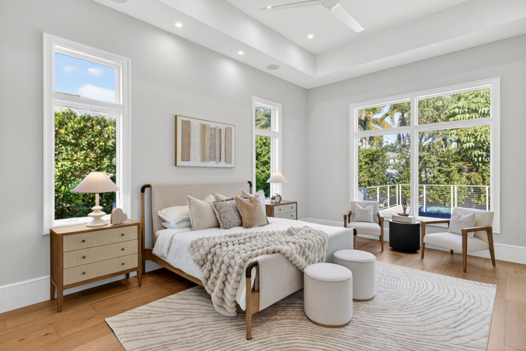 Alt text: Professionally staged luxury bedroom at Bowline featuring layered bedding, premium furnishings, and elegant finishing touches. 
