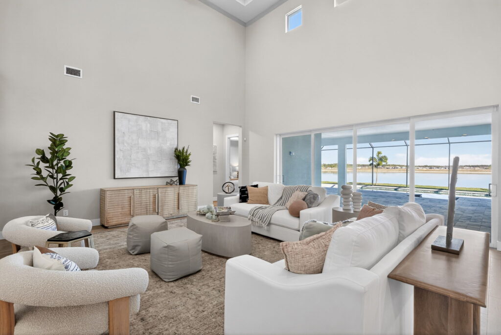 Alt text: Professionally staged luxury living room at Wisteria featuring properly scaled furniture and an open-concept layout. 
